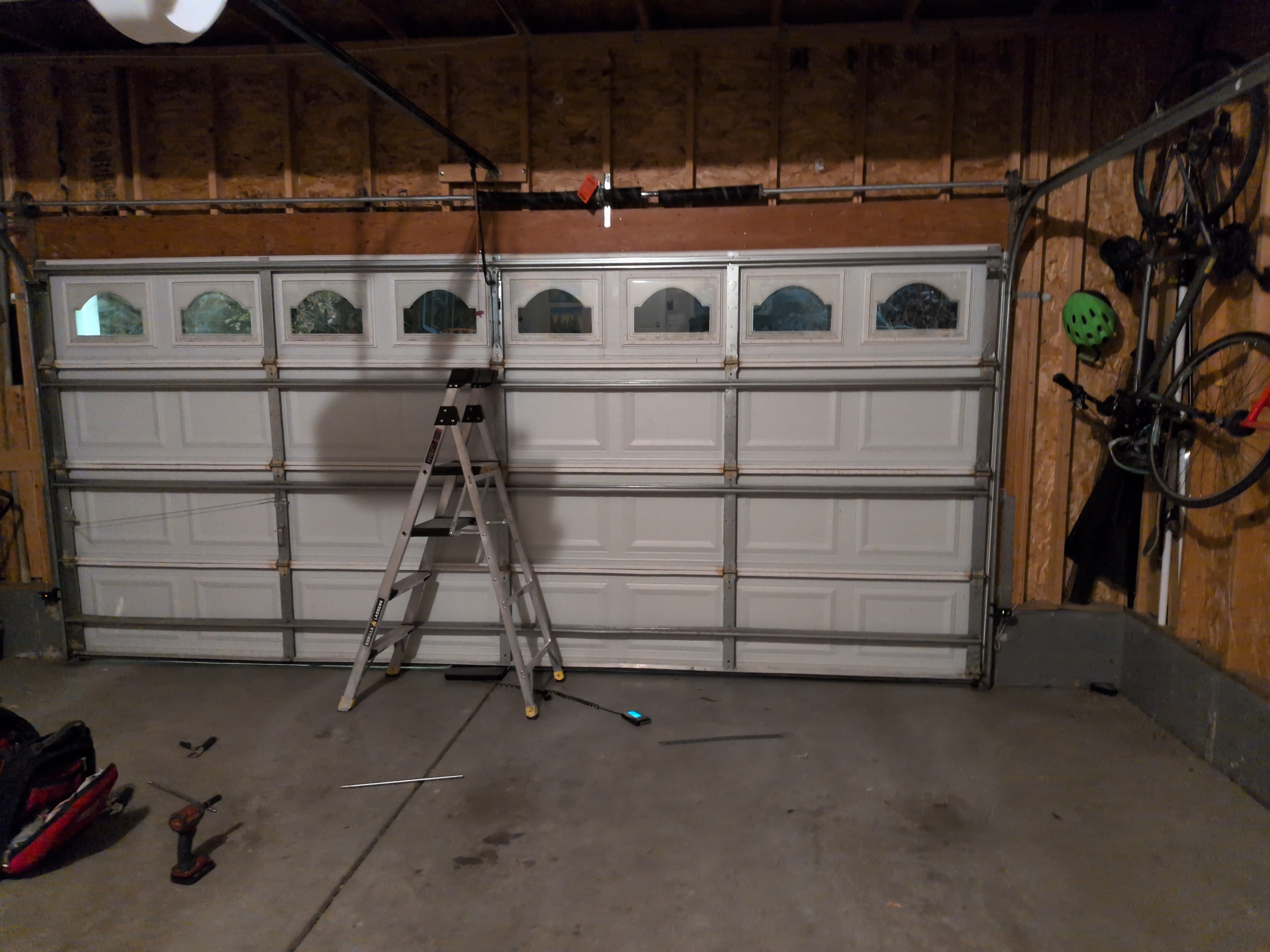 Garage door repair and installation in progress